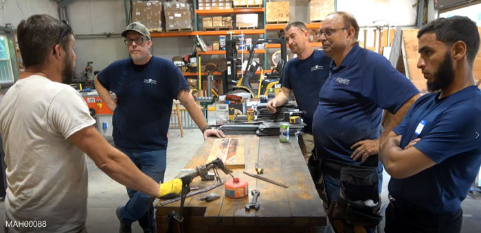 Brent Ulisky demonstrating soldering techniques at the Slate Roof Training Center.